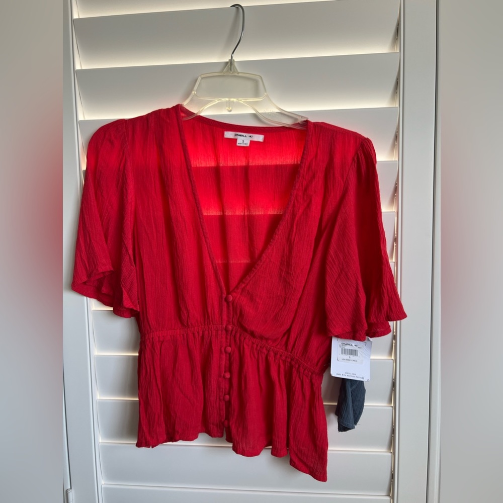 O’Neill red crop top with short sleeves, V-neck size small